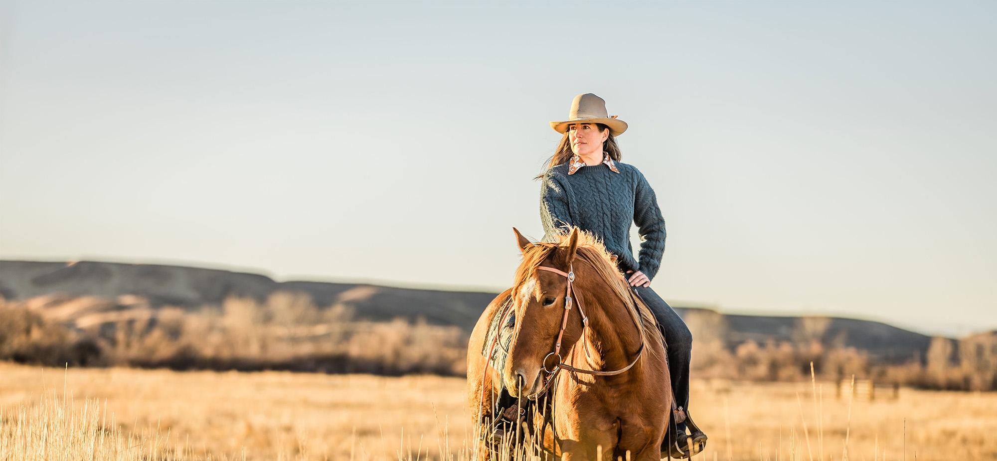 Rachel Larsen on horseback wearing cowboy hat